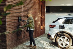 Residential EV charger mounted on an exterior wall of a Portland home