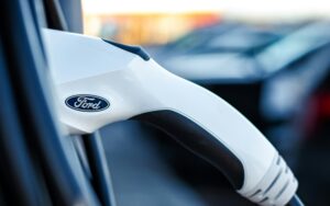 Ford electric vehicle plugged into a residential EV charging station in Portland.