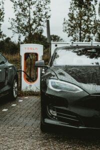 Tesla EV charging stations in a commercial Portland parking lot