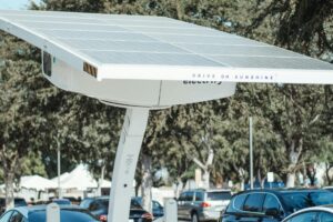 Eco-friendly solar panel charging station for electric vehicles outdoors.