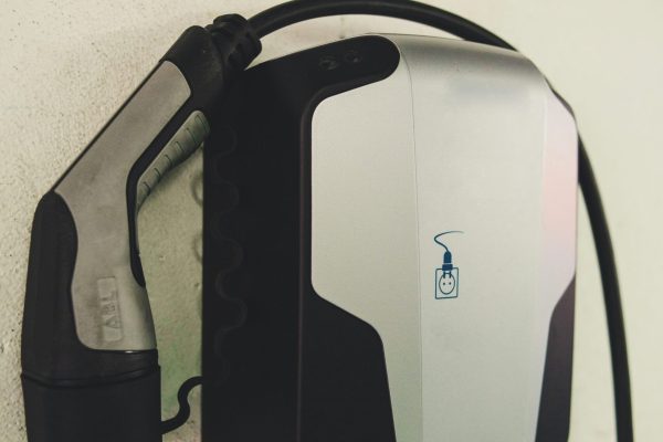 EV charger serving customers at a business parking location