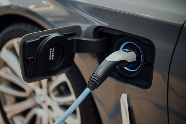 Electric vehicle charging at a public station in Portland